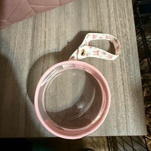 Pink Itzy Ritzy pacifier holder